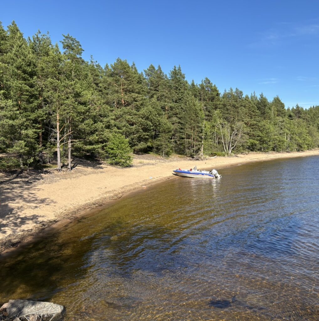 Boat on a sandy beach by Lake Saimaa in Puumala