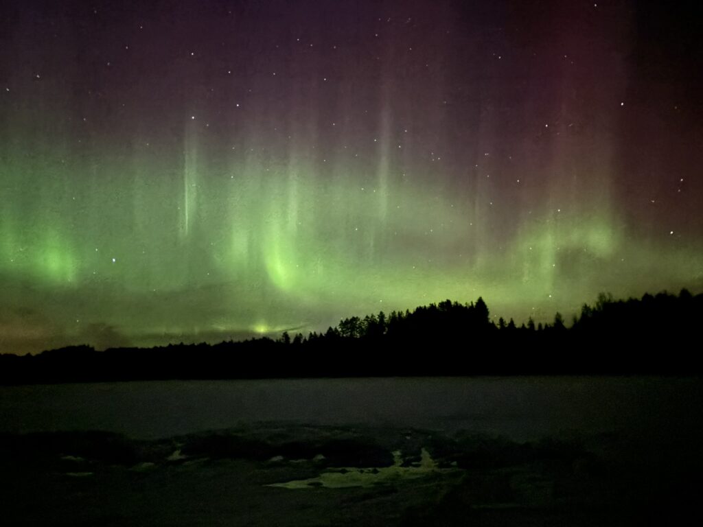 Northern lights over Lake Saimaa in Puumala, Finland